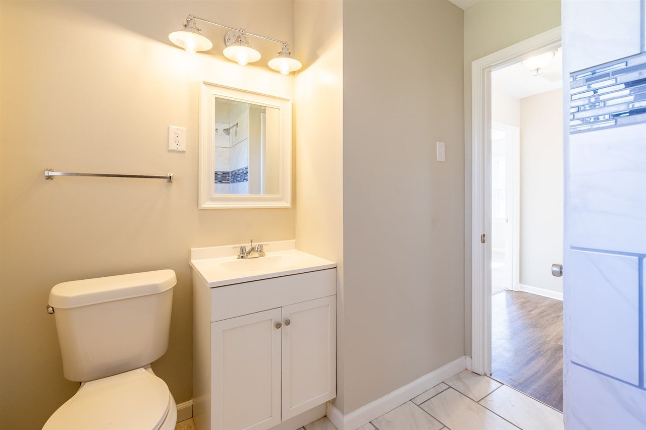 5350 Mesquite Road Memphis, TN 38120 - Photo 15 of 24 a bathroom with a toilet sink and mirror