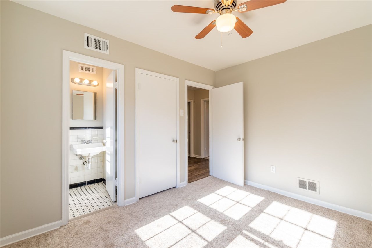 5350 Mesquite Road Memphis, TN 38120 - Photo 16 of 24 a view of livingroom with hardwood floor and white cabinet