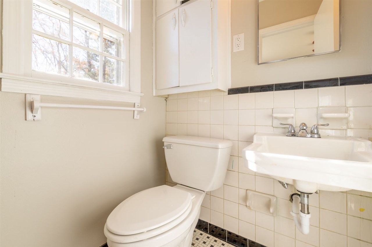 5350 Mesquite Road Memphis, TN 38120 - Photo 17 of 24 a white toilet sitting next to a window