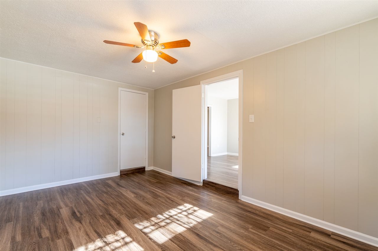 5350 Mesquite Road Memphis, TN 38120 - Photo 6 of 24 a view of an empty room and wooden floor