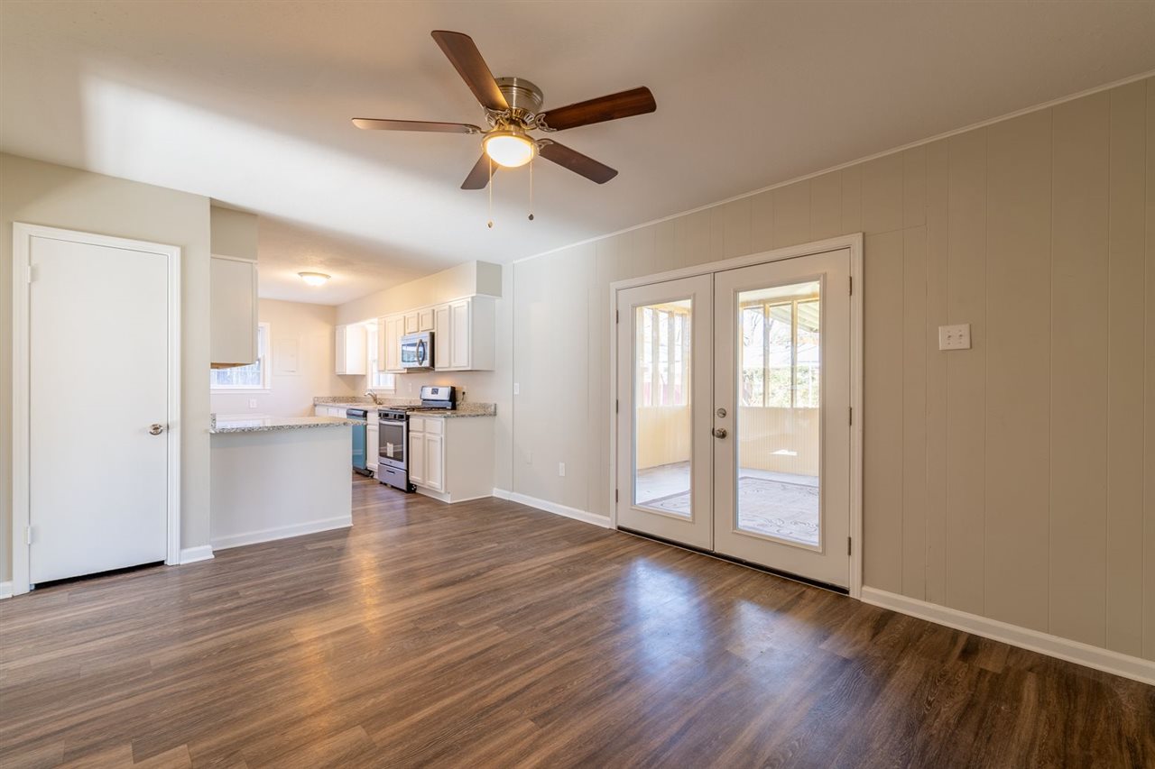 5350 Mesquite Road Memphis, TN 38120 - Photo 8 of 24 a view of a kitchen with wooden floor and a window