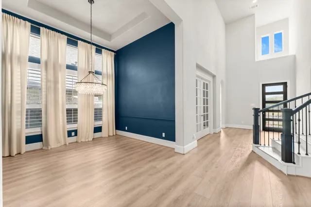 a view of an empty room with glass door