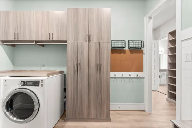 a view of storage and utility room with washer and dryer