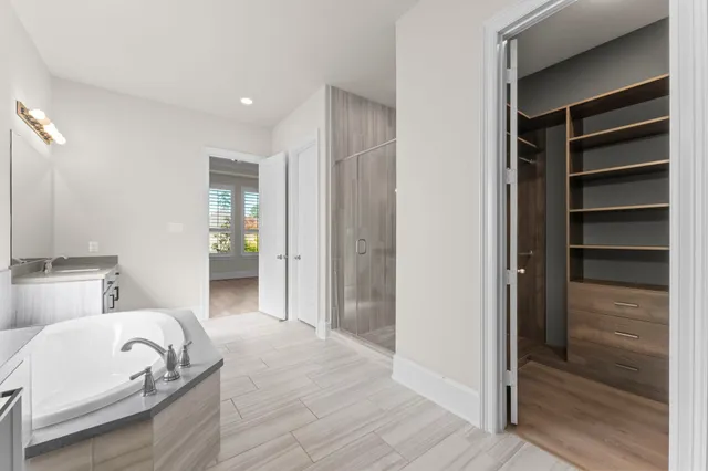 a bedroom with a bed and a walk in closet