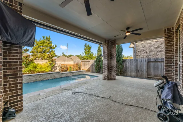a view of a porch with furniture and a garage