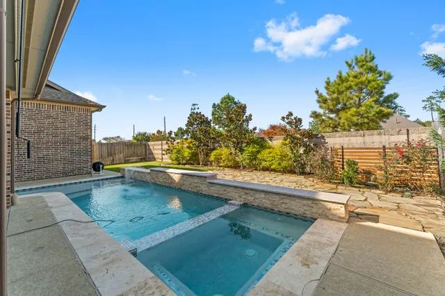 a view of a swimming pool with a lounge chairs