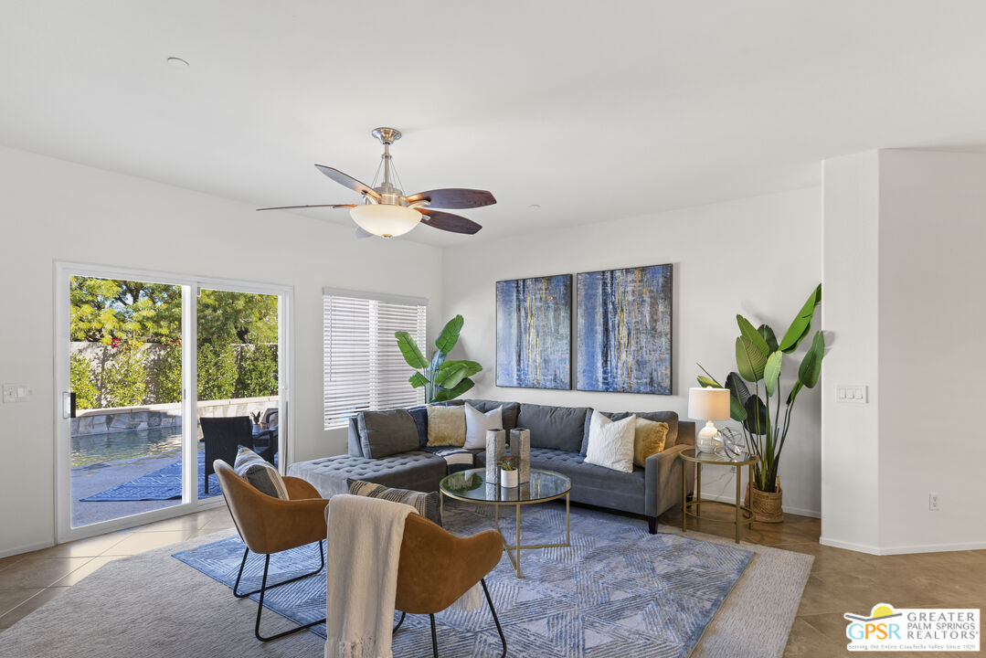 1264 Oro Ridge Palm Springs, CA 92262 - Photo 11 of 38 a living room with furniture and a large window