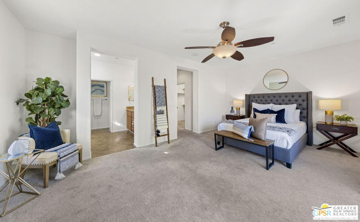 1264 Oro Ridge Palm Springs, CA 92262 - Photo 19 of 38 a living room with furniture and a chandelier