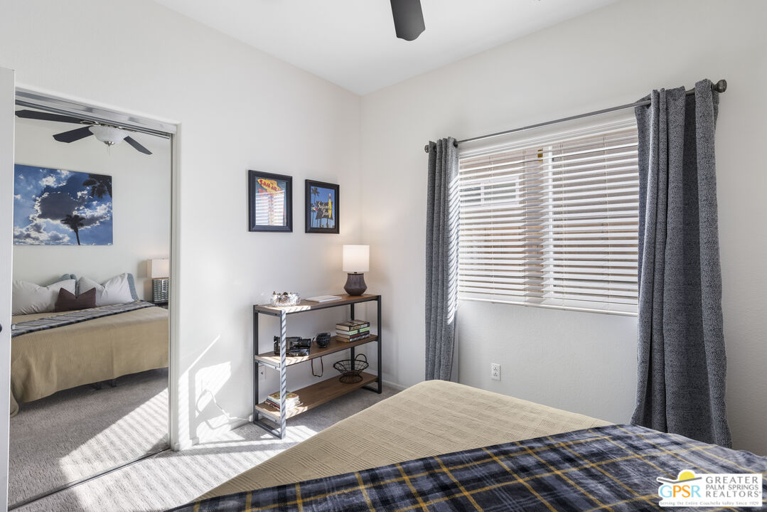 1264 Oro Ridge Palm Springs, CA 92262 - Photo 23 of 38 a bedroom with a bed and a window