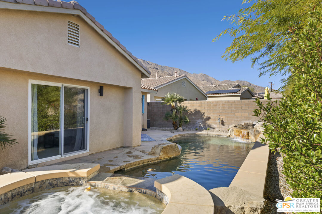 1264 Oro Ridge Palm Springs, CA 92262 - Photo 28 of 38 a backyard of a house with seating space