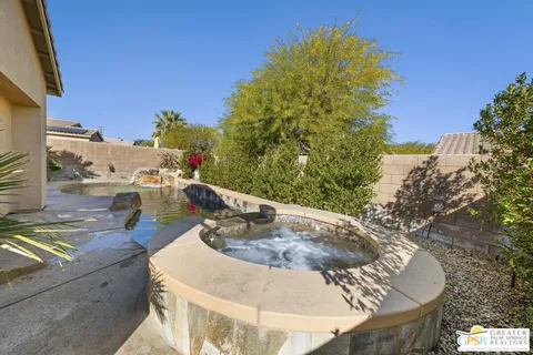 a swimming pool with outdoor seating