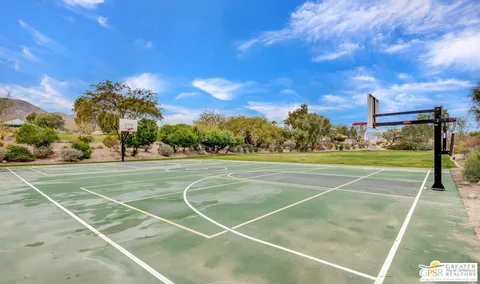 a view of a swimming pool with sitting area