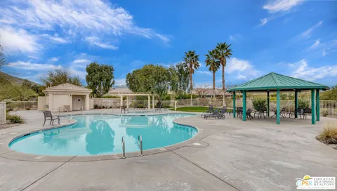 a view of a backyard with sitting area