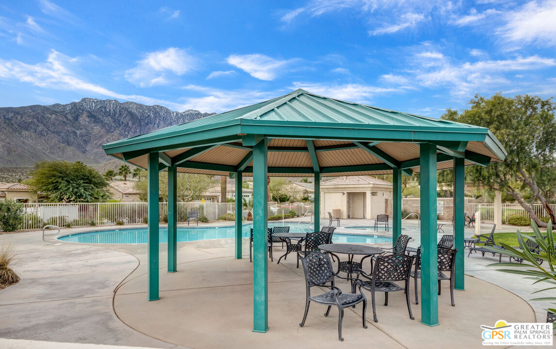 1264 Oro Ridge Palm Springs, CA 92262 - Photo 35 of 38 an outdoor space with furniture and umbrella