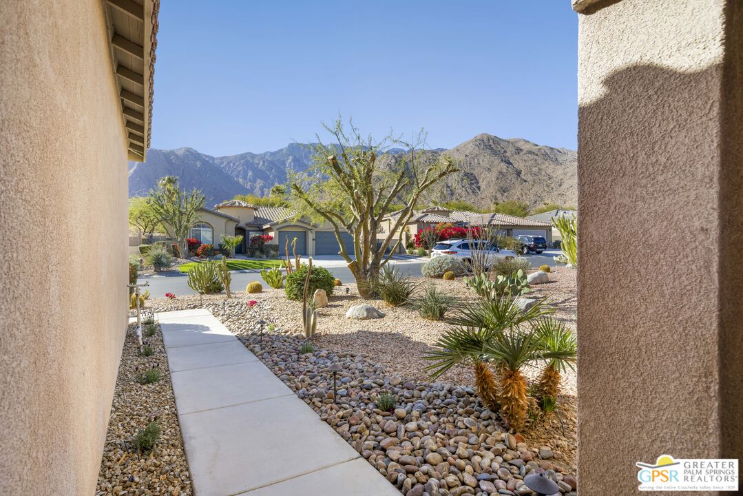 1264 Oro Ridge Palm Springs, CA 92262 - Photo 5 of 38 a view of a chairs and table in a backyard