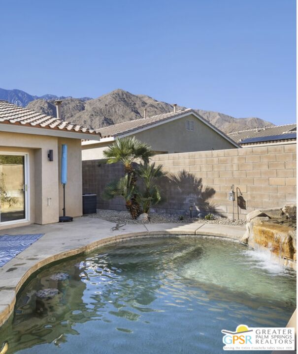 1264 Oro Ridge Palm Springs, CA 92262 - Photo 6 of 38 a view of a house with a swimming pool