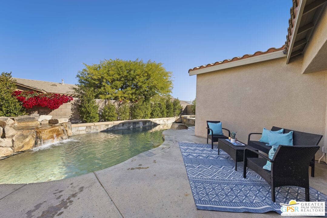 1264 Oro Ridge Palm Springs, CA 92262 - Photo 7 of 38 a view of a swimming pool with a patio
