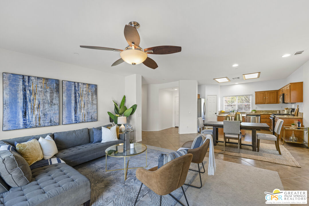 1264 Oro Ridge Palm Springs, CA 92262 - Photo 9 of 38 a living room with furniture kitchen view and a chandelier