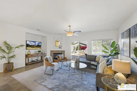 a living room with furniture and a large window