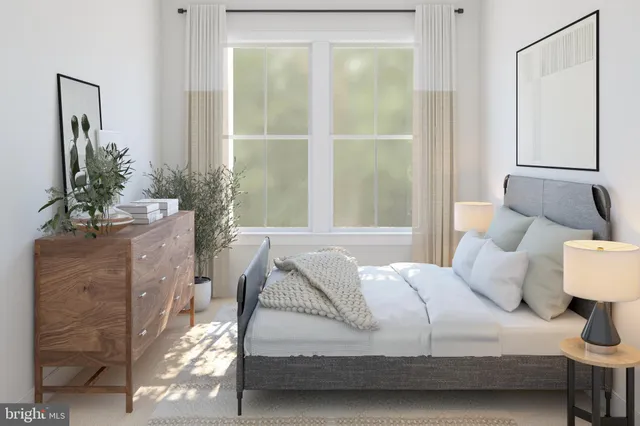 a bedroom with a bed and a mirror