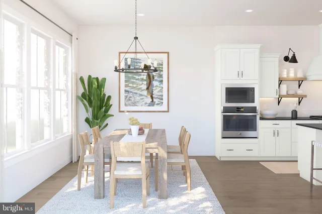 a view of a dining room with furniture and a window
