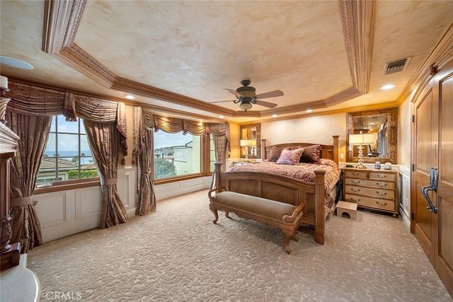 a bed room with a bed and a large window