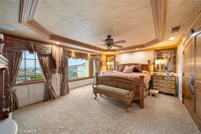 a bed room with a bed and a large window