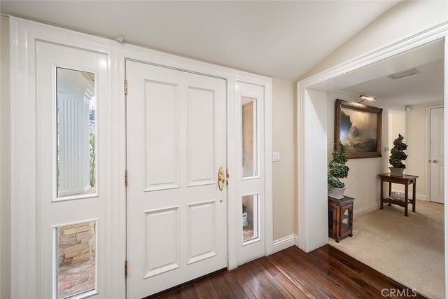 a view of livingroom with hardwood floor and hallway