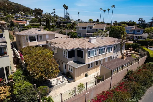 an aerial view of a house with a garden