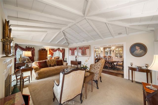 a living room with lots of furniture and a large window