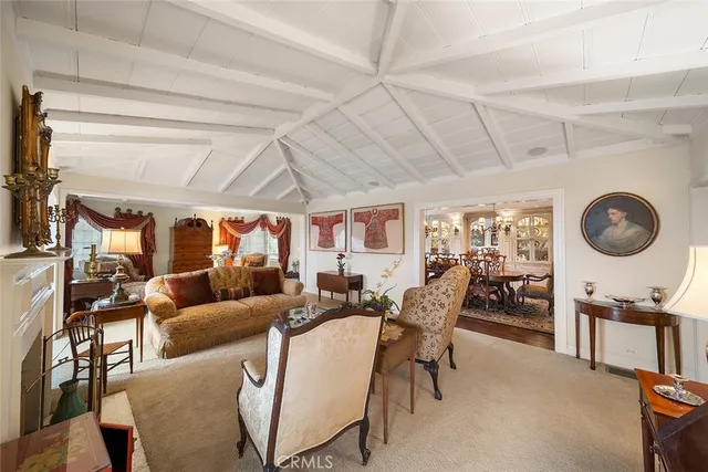 a living room with lots of furniture and a large window