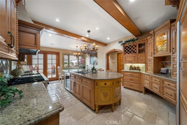 a kitchen with stainless steel appliances granite countertop a stove and a refrigerator