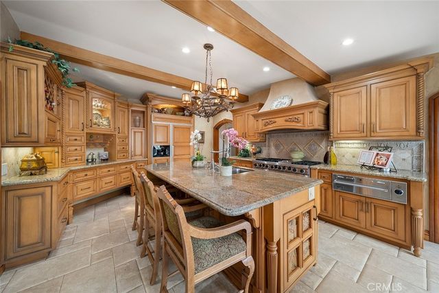 a kitchen with cabinets a sink and appliances