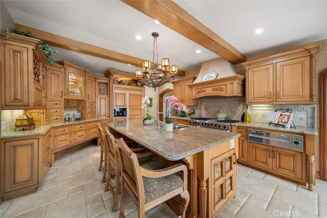 a kitchen with cabinets a sink and appliances