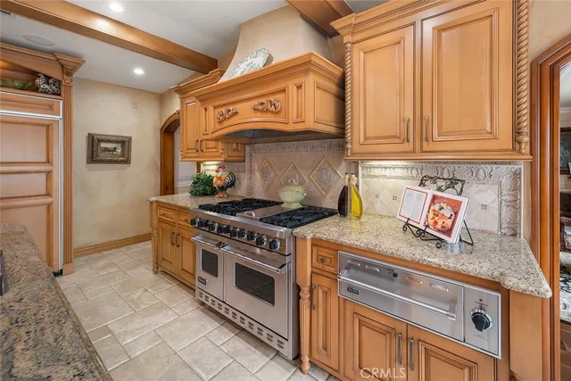 a kitchen with stainless steel appliances granite countertop a stove and a sink