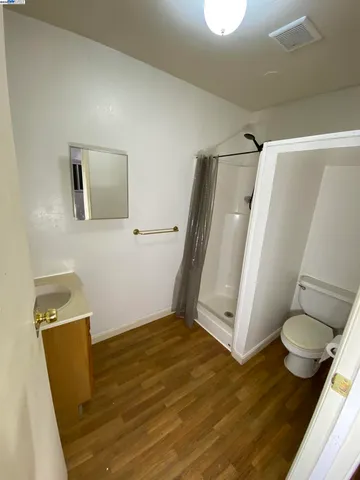 a view of bathroom with a sink and mirror