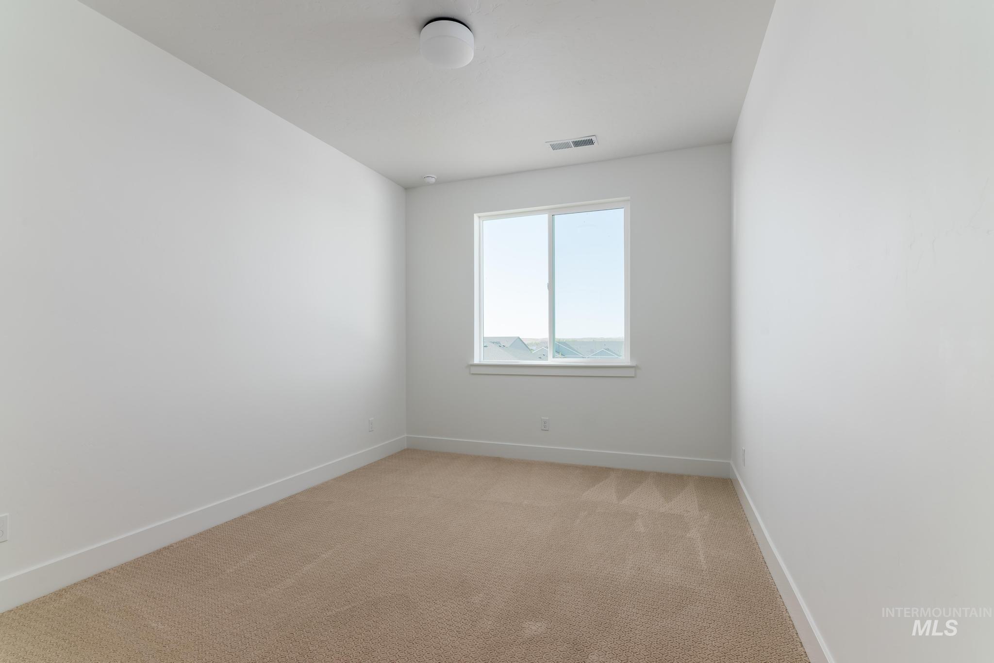 14703 Serenity Pt Street Caldwell, ID 83607 - Photo 29 of 45 Neutral-toned carpet flooring, white walls, and a single window with white trim