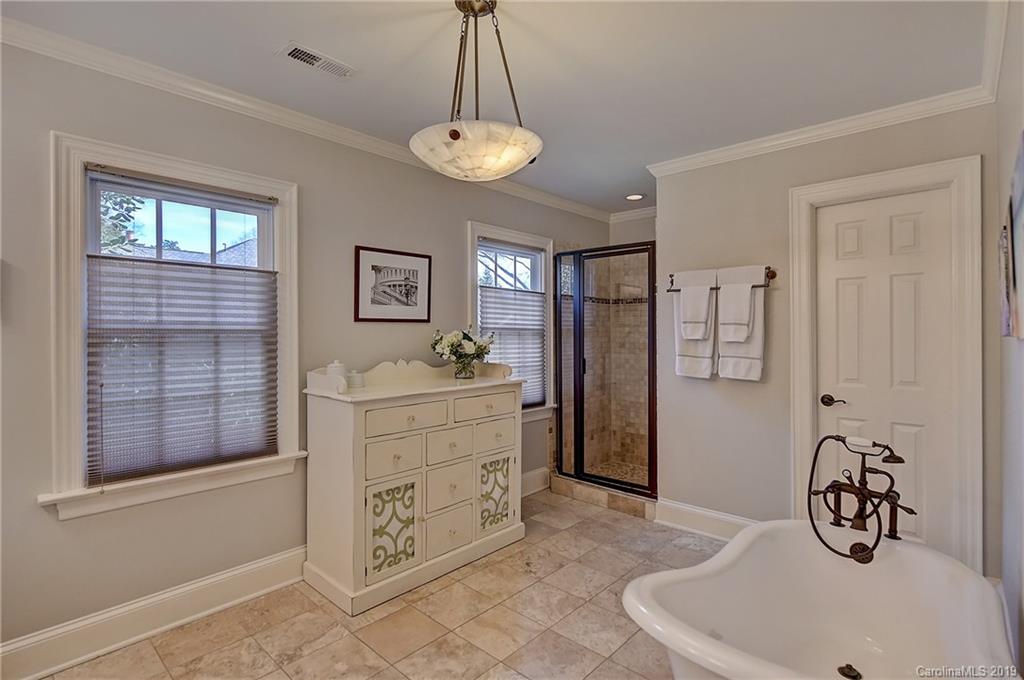 2243 Providence Road Charlotte, NC 28211 - Photo 22 of 35 a view of a center island and chandelier