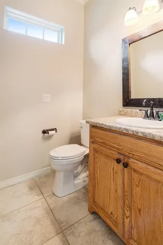 a living room with a bed furniture and a large window