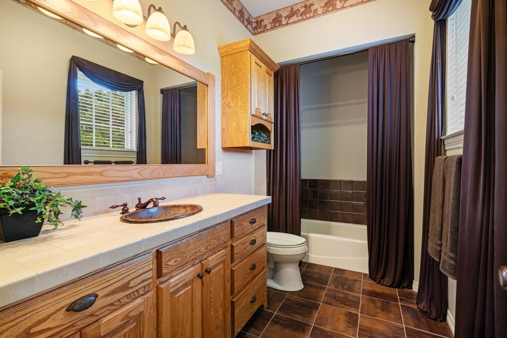 5500 Farm Road 195 Paris, TX 75462 - Photo 24 of 40 a bathroom with a sink a toilet and shower
