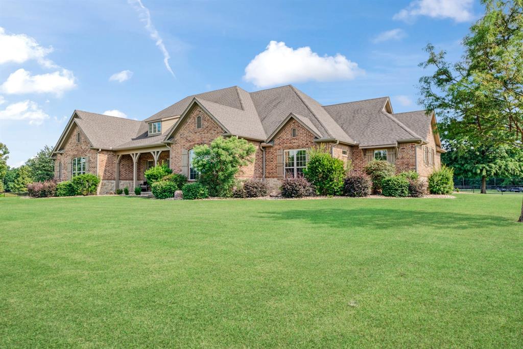 5500 Farm Road 195 Paris, TX 75462 - Photo 26 of 40 a front view of a house with a yard