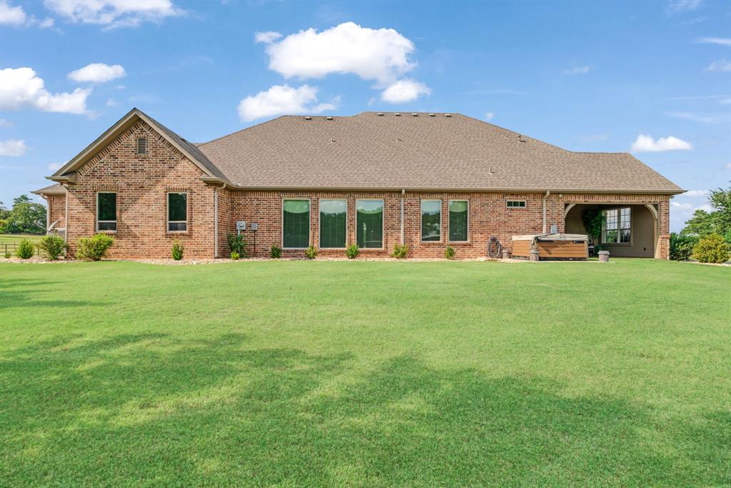 5500 Farm Road 195 Paris, TX 75462 - Photo 28 of 40 a front view of a house with a yard