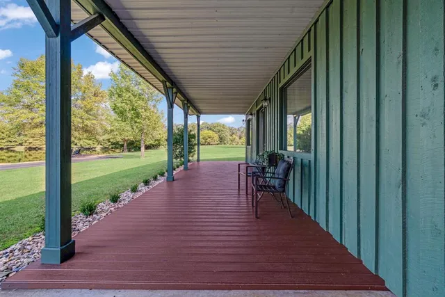 a view of a backyard with wooden fence