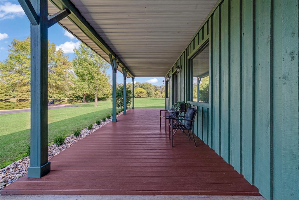 5500 Farm Road 195 Paris, TX 75462 - Photo 31 of 40 a view of a porch with wooden floor and stairs