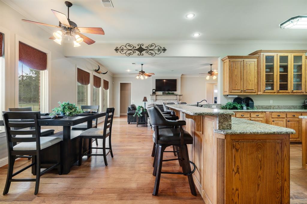 5500 Farm Road 195 Paris, TX 75462 - Photo 9 of 40 a view of a a dining room with furniture window and wooden floor