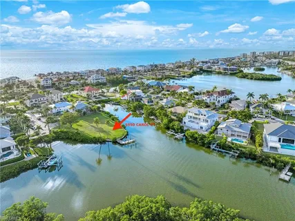 an aerial view of a house with a lake view