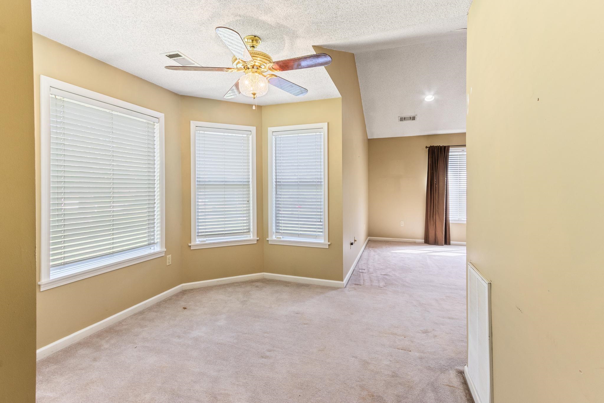 380 Woodbridge Road Somerville, TN 38068 - Photo 14 of 30 Carpeted empty room featuring a textured ceiling and a ceiling fan