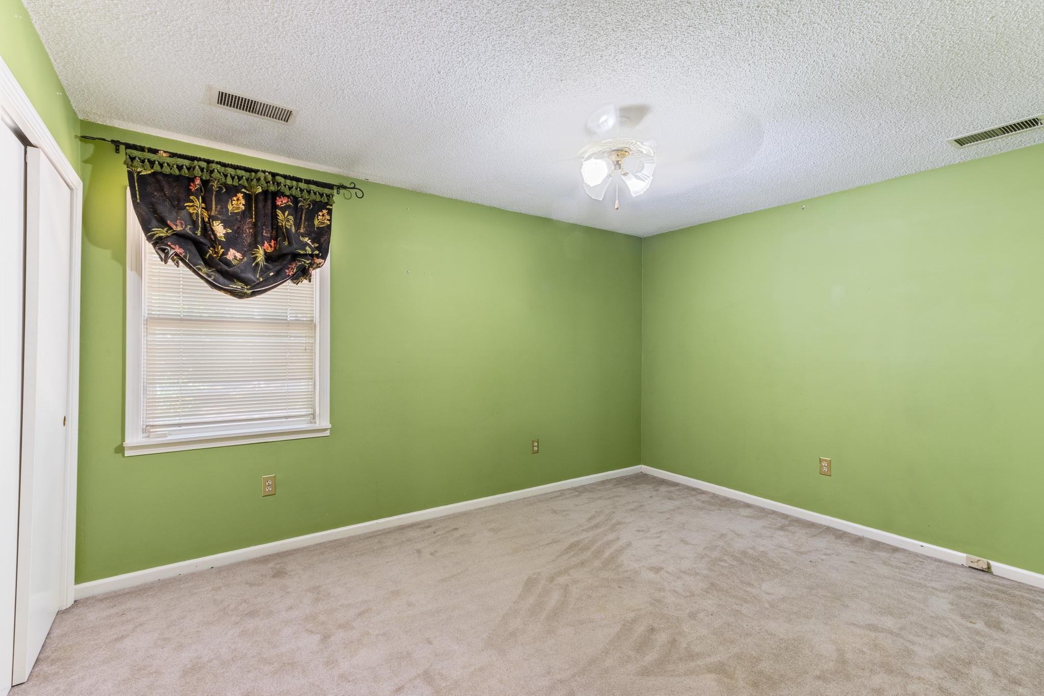 380 Woodbridge Road Somerville, TN 38068 - Photo 18 of 30 Unfurnished room with a textured ceiling, carpet, and ceiling fan