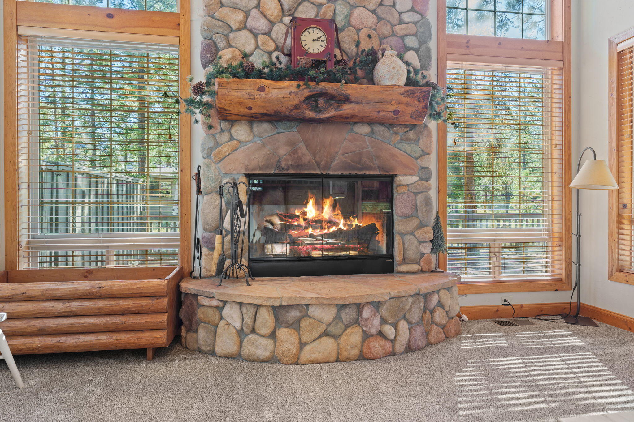 58026 Kinglet Road Sunriver, OR 97707 - Photo 7 of 39 a living room with furniture and a fireplace