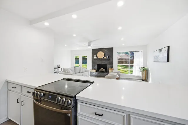 a kitchen with a stove and a sink